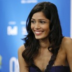 Actor Pinto smiles during news conference at the 33rd Toronto International Film Festival